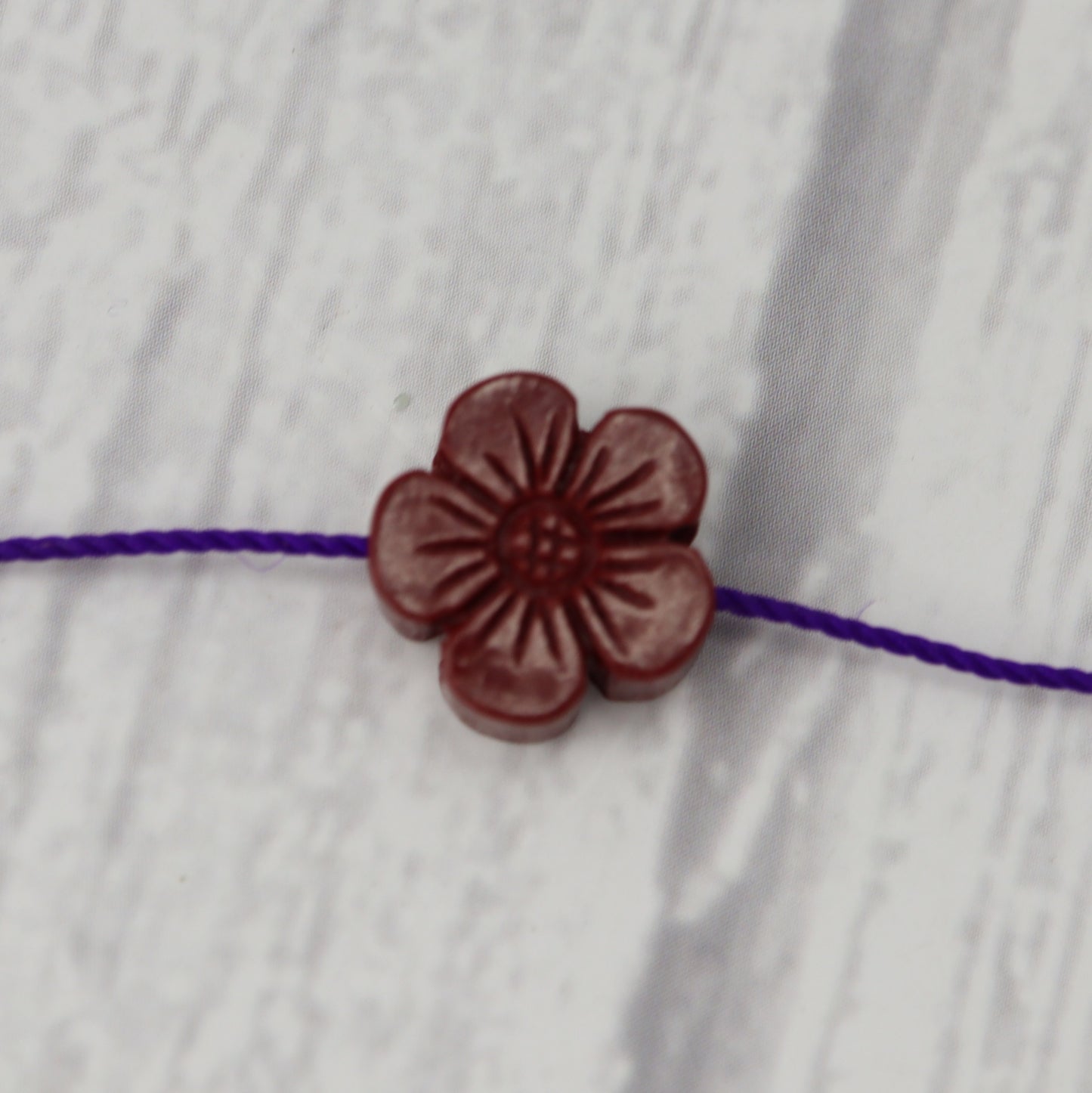 Cinnabar Flower Charm