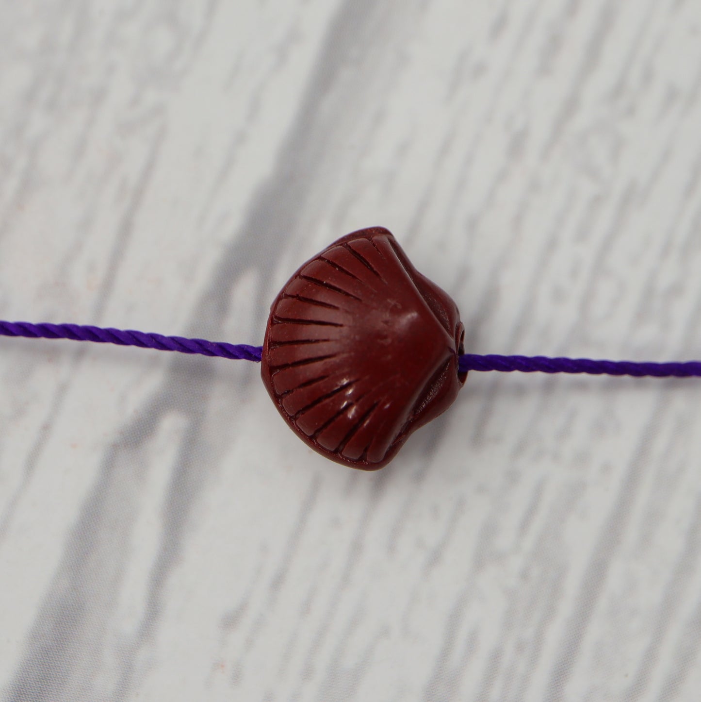 Cinnabar Shell Charm