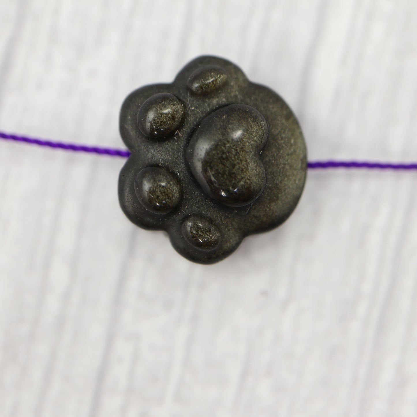 Golden Obsidian Paw Charm